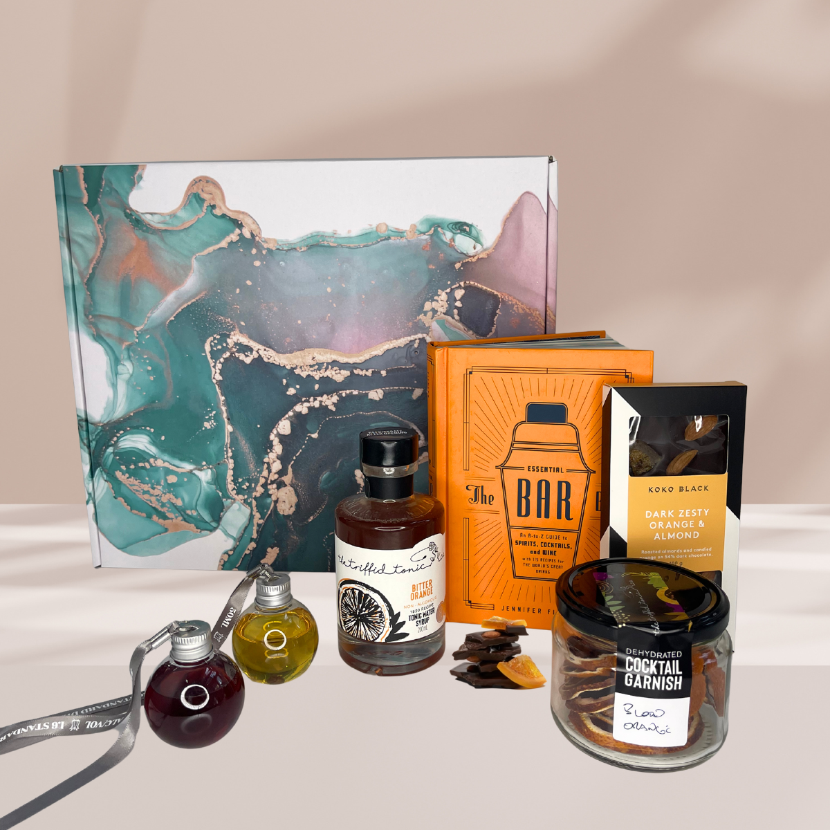 Christmas Hamper Box with Bitter Orange Tonic, Koko Black Orange Chocolate Block, Cocktail Bible, Dried Blood Orange Slices and Gin Balls or Gin Tubes.