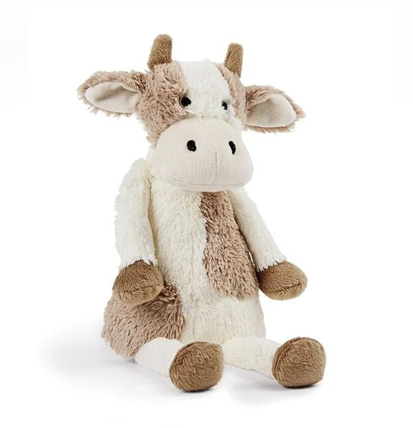 A set of plush baby toys designed to look like cows, with beige, white, and black coloring.