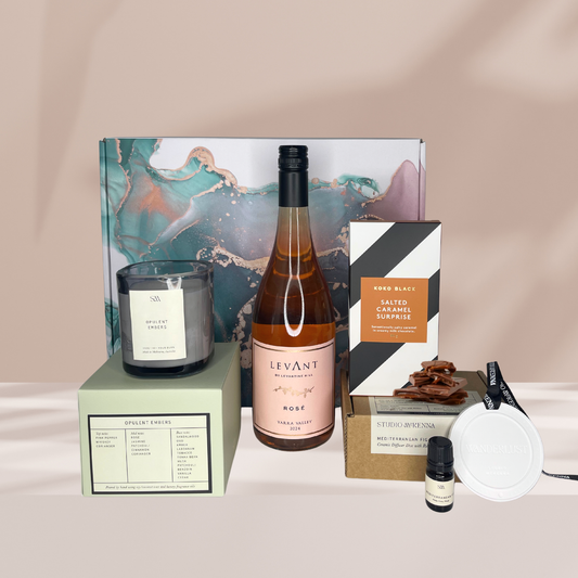Silent night in ; Christmas Hamper Box with Levant Rose , Koko Block Slated Caramel block , Studio McKenna Opulent embers candle , Studio McKenna Diffuser disc in Mediterranean fig scent. 