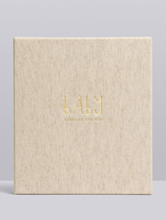 Beige album with 'BABY' text in gold on a light gray background
