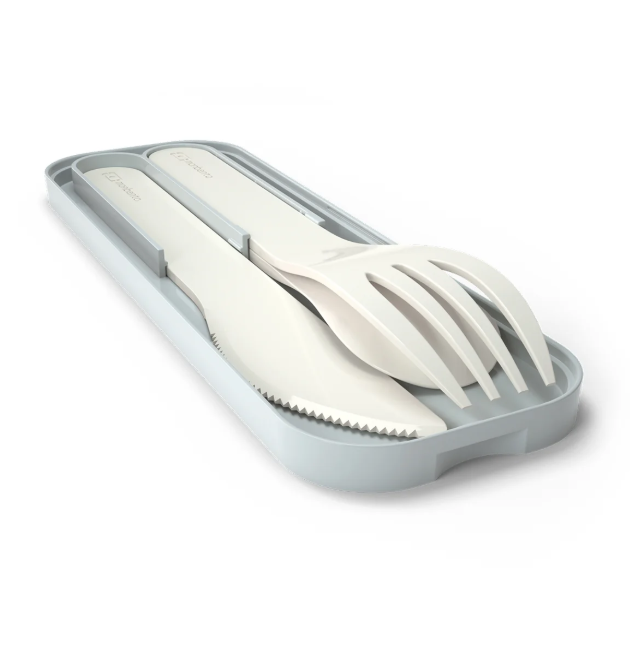 A set of white plastic cutlery, including a knife and fork, resting inside a matching light gray plastic travel case on a white background.