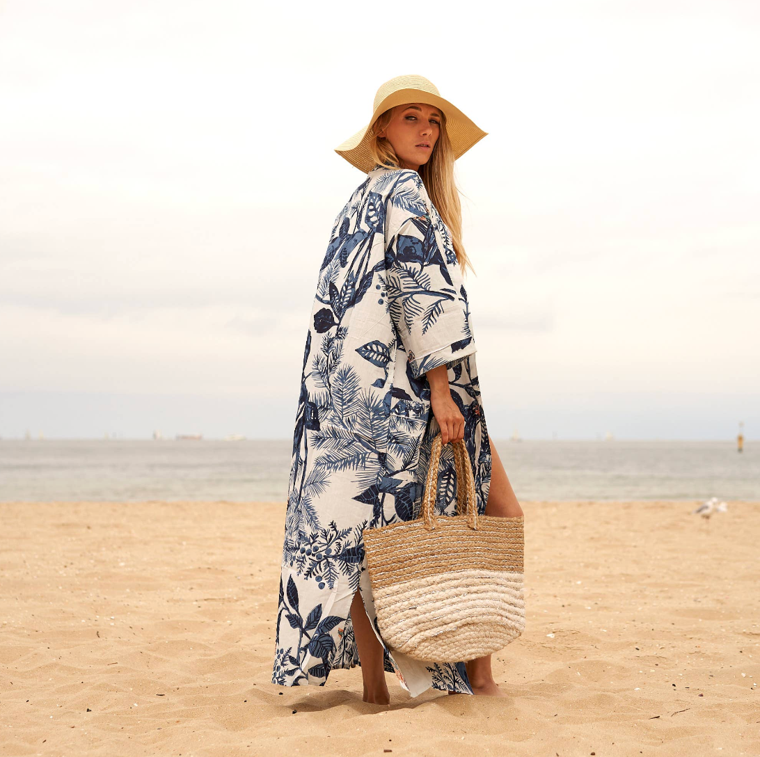 Woman in white and blue floral Kimono walking 
