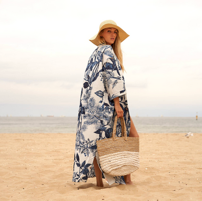 Woman in white and blue floral Kimono walking 