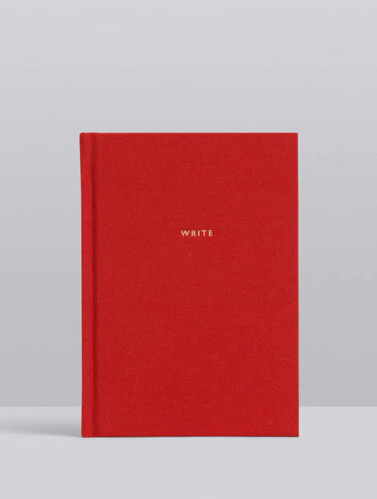 Red notebook with 'WRITE' 