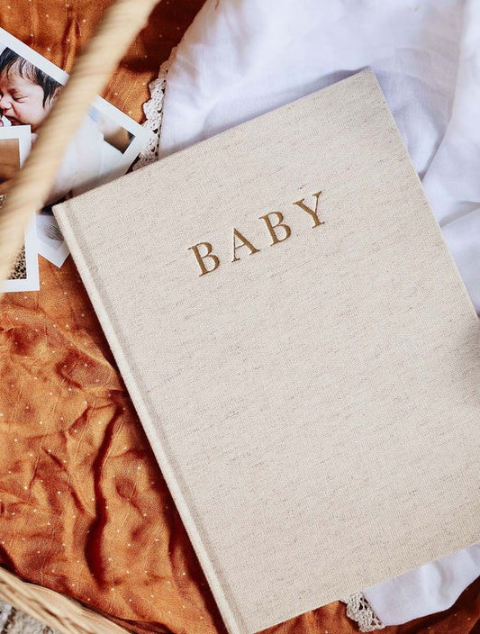 Beige baby album with 'BABY' 