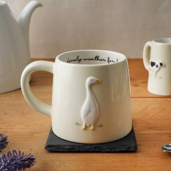 White mug with duck design 