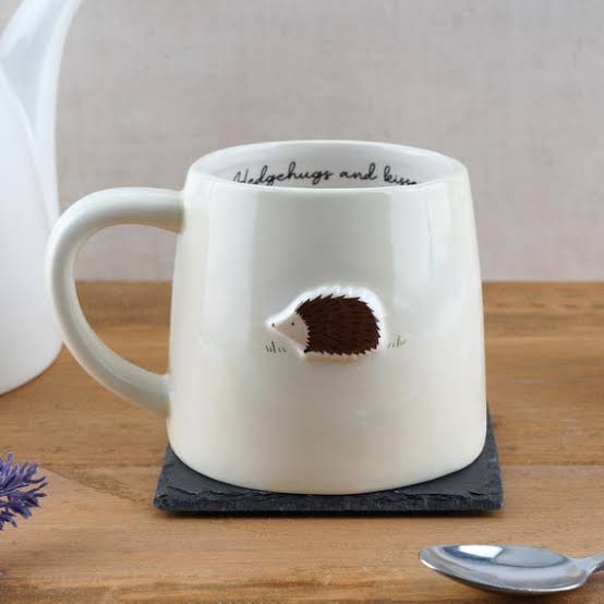 White mug with hedgehog design