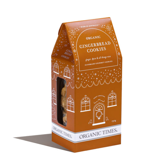 Orange packaging of Organic Times gingerbread cookies with decorative elements.